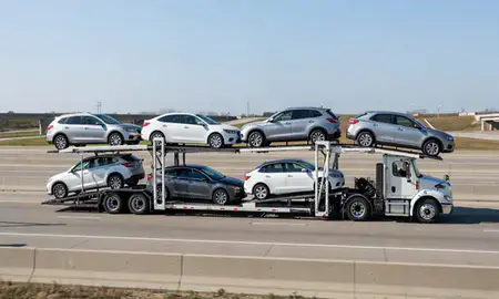 Multi-level car carrier on the highway to Toledo, Ohio, United States