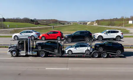Multi-level car carrier on the highway to Youngstown, Ohio, United States