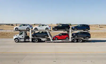 Multi-level car carrier on the highway to Oklahoma, United States