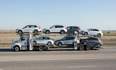 Multi-level car carrier on the highway to Ardmore, Oklahoma, United States