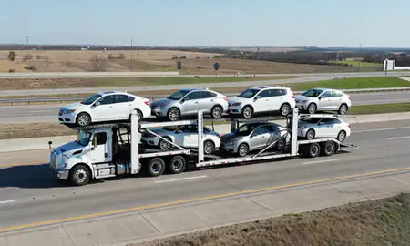 Multi-level car carrier on the highway to Bartlesville, Oklahoma, United States