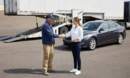 Vehicle owner beside their delivered car in Bixby, Oklahoma, United States