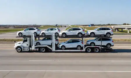 Multi-level car carrier on the highway to Broken Arrow, Oklahoma, United States