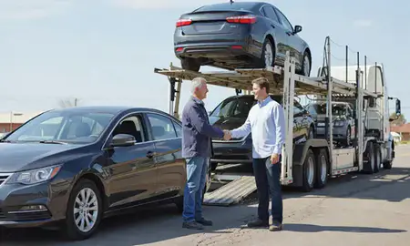 Vehicle owner beside their delivered car in Claremore, Oklahoma, United States