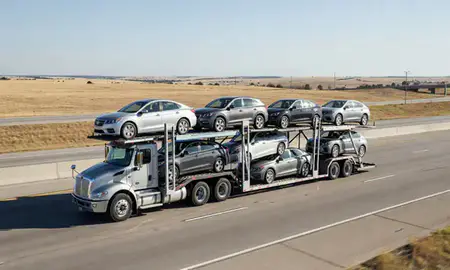 Multi-level car carrier on the highway to Duncan, Oklahoma, United States