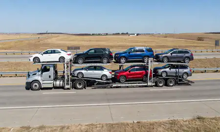 Multi-level car carrier on the highway to Edmond, Oklahoma, United States