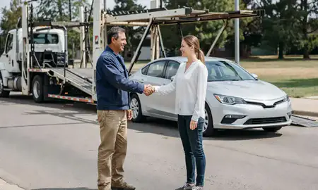 Vehicle owner beside their delivered car in Edmond, Oklahoma, United States