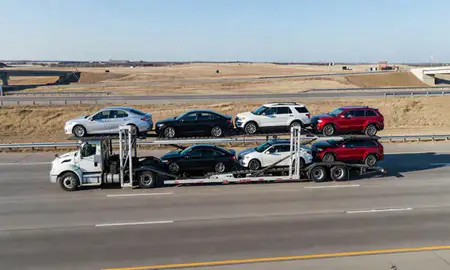 Multi-level car carrier on the highway to Jenks, Oklahoma, United States