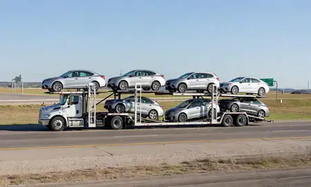Multi-level car carrier on the highway to Lawton, Oklahoma, United States