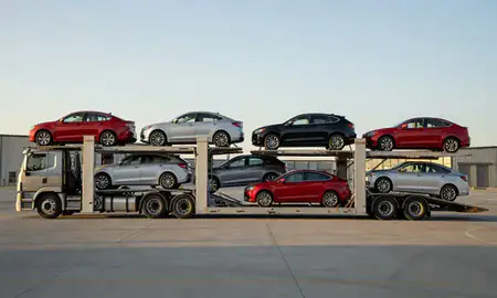 Car transporter parked in an industrial area of McAlester, Oklahoma, United States