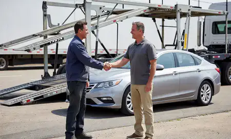 Vehicle owner beside their delivered car in Moore, Oklahoma, United States
