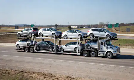 Multi-level car carrier on the highway to Muskogee, Oklahoma, United States