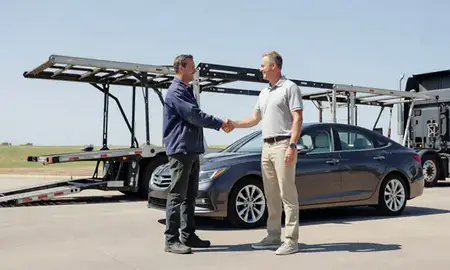 Vehicle owner beside their delivered car in Muskogee, Oklahoma, United States