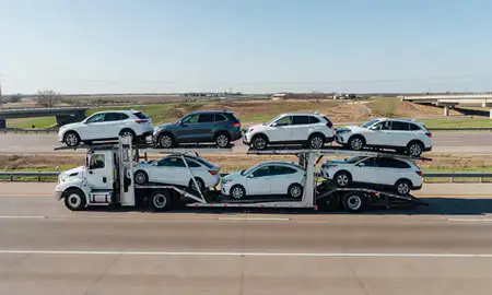 Multi-level car carrier on the highway to Mustang, Oklahoma, United States