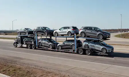 Multi-level car carrier on the highway to Norman, Oklahoma, United States