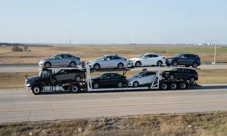 Multi-level car carrier on the highway to Ponca City, Oklahoma, United States