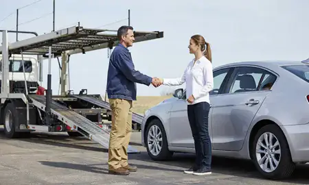 Vehicle owner beside their delivered car in Ponca City, Oklahoma, United States