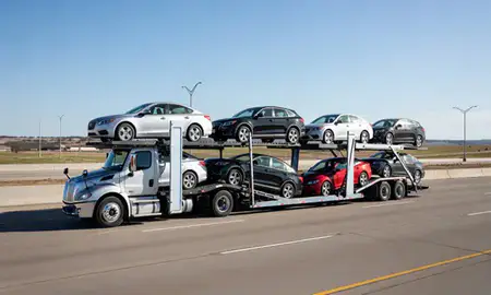 Multi-level car carrier on the highway to Tulsa, Oklahoma, United States