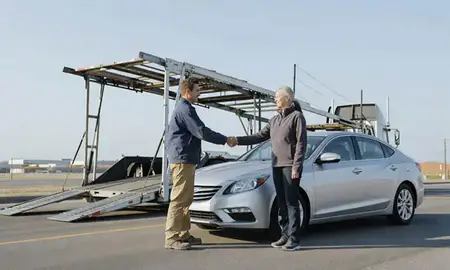 Vehicle owner beside their delivered car in Yukon, Oklahoma, United States