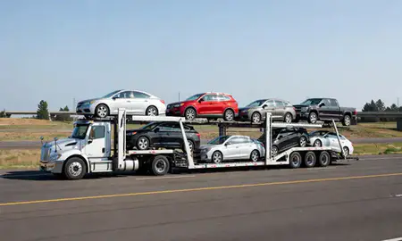 Multi-level car carrier on the highway to Oregon, United States