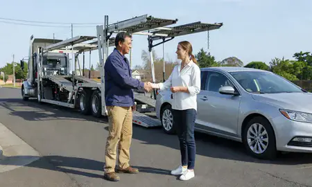 Vehicle owner beside their delivered car in Aloha, Oregon, United States