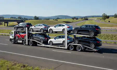 Multi-level car carrier on the highway to Bethany, Oregon, United States