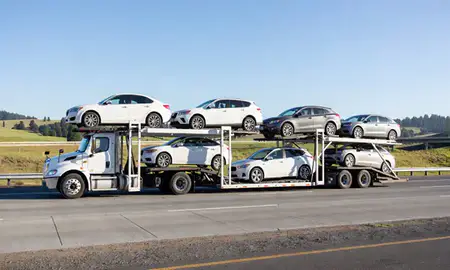 Multi-level car carrier on the highway to Eugene, Oregon, United States
