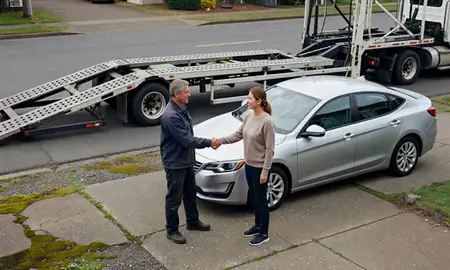 Vehicle owner beside their delivered car in Gresham, Oregon, United States
