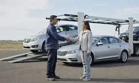 Vehicle owner beside their delivered car in Hillsboro, Oregon, United States