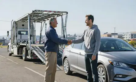 Vehicle owner beside their delivered car in Klamath Falls, Oregon, United States