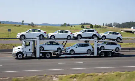 Multi-level car carrier on the highway to Newberg, Oregon, United States