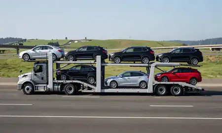 Multi-level car carrier on the highway to Portland, Oregon, United States