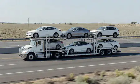 Multi-level car carrier on the highway to Redmond, Oregon, United States