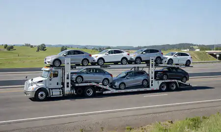 Multi-level car carrier on the highway to Salem, Oregon, United States