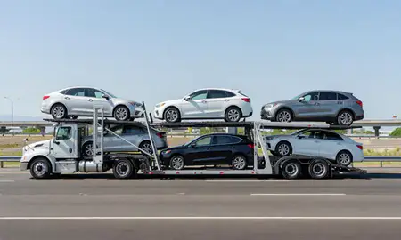Multi-level car carrier on the highway to Springfield, Oregon, United States