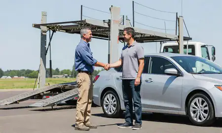 Vehicle owner beside their delivered car in Wilsonville, Oregon, United States