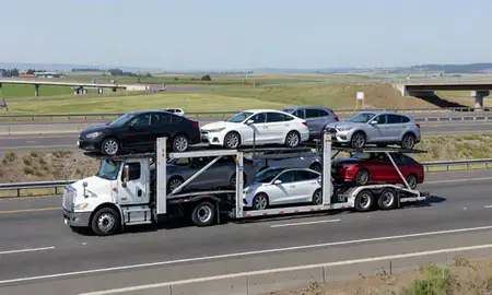 Multi-level car carrier on the highway to Woodburn, Oregon, United States