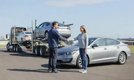 Vehicle owner beside their delivered car in Woodburn, Oregon, United States
