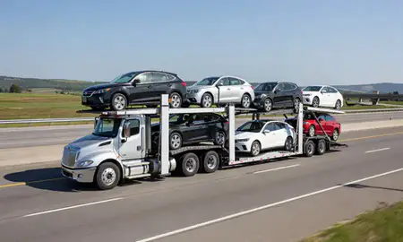 Multi-level car carrier on the highway to Pennsylvania, United States
