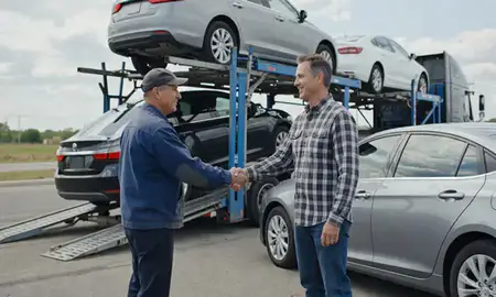 Vehicle owner beside their delivered car in Pennsylvania, United States