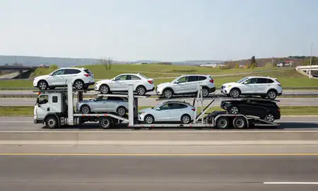 Multi-level car carrier on the highway to Altoona, Pennsylvania, United States