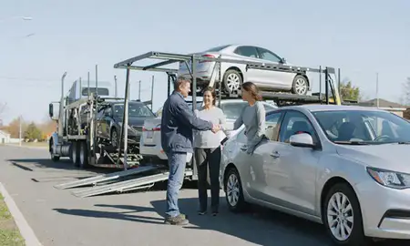 Vehicle owner beside their delivered car in Baldwin, Pennsylvania, United States