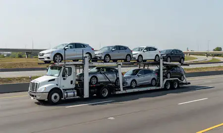 Multi-level car carrier on the highway to Chester, Pennsylvania, United States