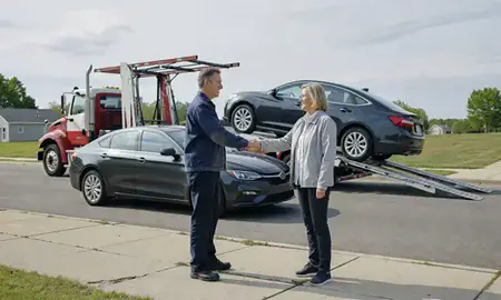 Vehicle owner beside their delivered car in Drexel Hill, Pennsylvania, United States