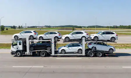 Multi-level car carrier on the highway to Erie, Pennsylvania, United States