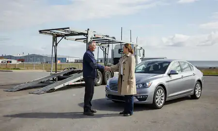 Vehicle owner beside their delivered car in Erie, Pennsylvania, United States