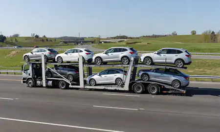 Multi-level car carrier on the highway to Harrisburg, Pennsylvania, United States