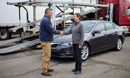 Vehicle owner beside their delivered car in Hazleton, Pennsylvania, United States