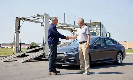 Vehicle owner beside their delivered car in King of Prussia, Pennsylvania, United States