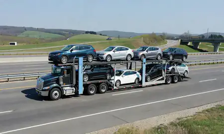 Multi-level car carrier on the highway to New Castle, Pennsylvania, United States